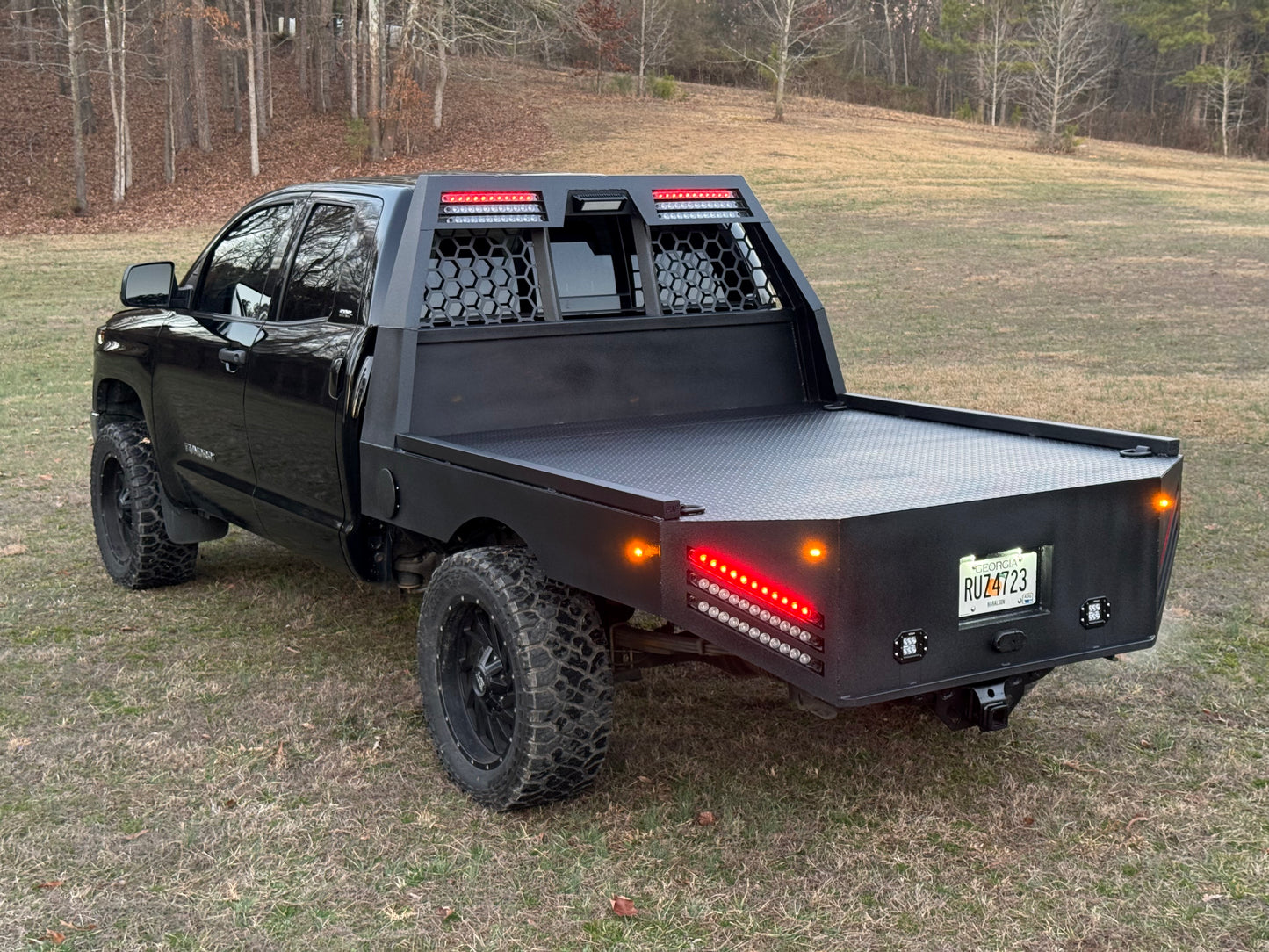 A custom USA styled skirted flatbed on a 2018 2nd gen toyota tundra double cab. the flatbed was custom made by myself in Ringgold Georgia. can be fitted and made for any truck including ford chevy dodge and even Nissans. 